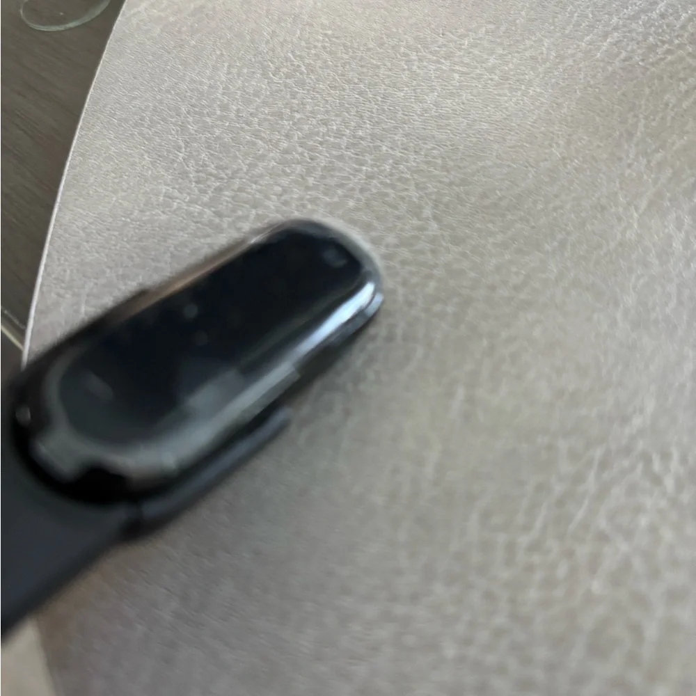 Black Fitness Tracker with Sleek Design and Wristband